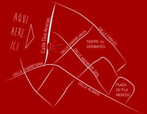 Un mapa simple en blanco sobre fondo rojo resalta las calles y los lugares de interés cercanos a un teatro, entre los que se encuentra Restaurante La Luz de la Candela - Málaga, que encapsula el espíritu vibrante de la ciudad. - ForTwo - Planes para parejas