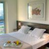 Alójese en el Hotel Neptuno en Valencia para disfrutar de una escapada con una acogedora cama doble, desayuno y cava, arte cautivador e impresionantes vistas del crucero. - ForTwo - Planes para parejas