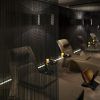 En el Mandarin Hotel en Barcelona SPA, una iluminación tenue crea un ambiente tranquilo con sillones elegantemente separados por cortinas oscuras y una figura serena en silencio al fondo. - ForTwo - Planes para parejas