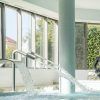 Relájese en una tranquila piscina cubierta con cascadas de agua, grandes ventanales y una estatua de Buda, que recuerda al Circuito de Spa con buffet libre y cava (Alicante). - ForTwo - Planes para parejas