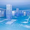 Experimente el lujo en la piscina cubierta del Hotel Gala en Tenerife, con columnas de mosaico azul, chorros de agua y plataformas sumergidas. Ideal para una sesión de spa en pareja gracias a su diseño espacioso y moderno. - ForTwo - Planes para parejas