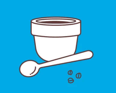 Un mortero con granos de café sobre fondo azul simboliza la esencia del "Taller de Cata de Café en Familia Osorio: ¡Conviértete en un Experto del Café!. - ForTwo - Planes para parejas
