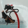 Alguien ejecutando un flip en un Flyboard en Valencia con el hermoso paisaje urbano de Valencia de fondo. - ForTwo - Planes para parejas