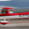 Un pequeño avión rojo y blanco despega con un desenfoque de movimiento dinámico, evocando la emoción de un vuelo en avión por Granada sobre sus paisajes escénicos. - ForTwo - Planes para parejas