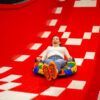 En Hi Jump Terrassa una persona disfruta de pura adrenalina y emoción mientras se desliza por un tobogán de color rojo brillante en un tubo hinchable. - ForTwo - Planes para parejas